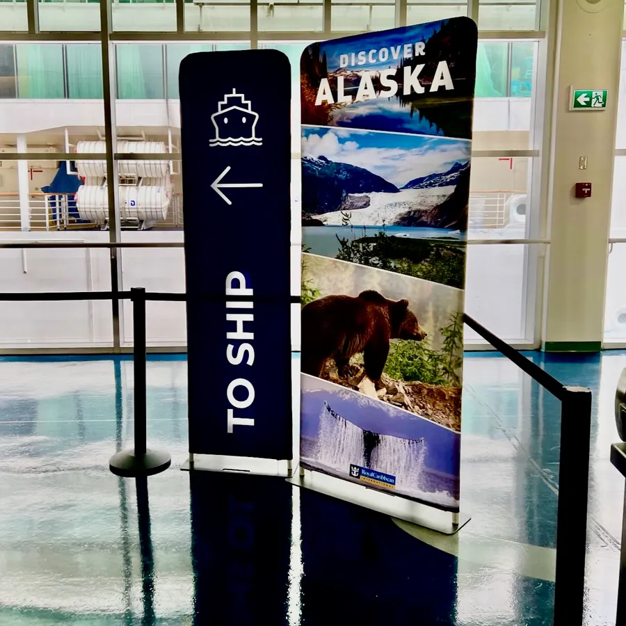 A sign saying 'Discover Alaska' and 'To Ship' at Vancouver Port