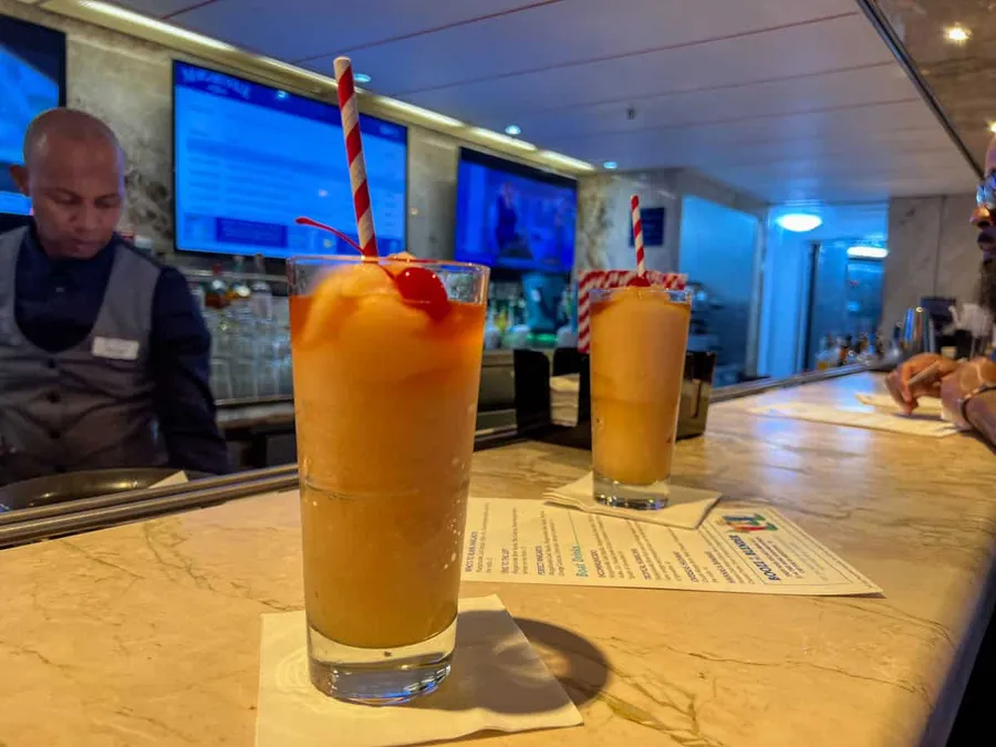 Two Pina coladas on a bar