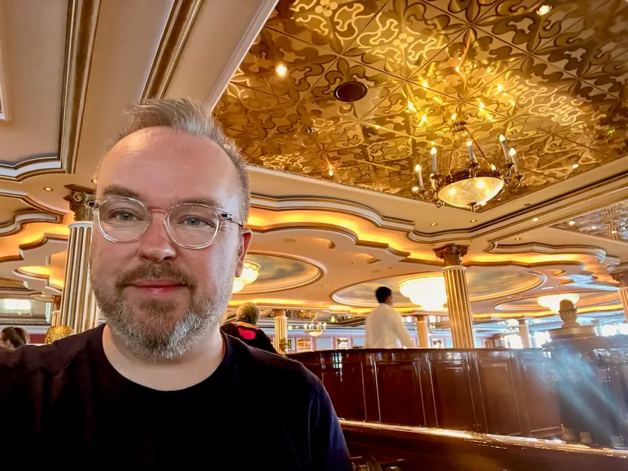 Selfie in the Norwegian Star ornate gold-ceilinged main dining room